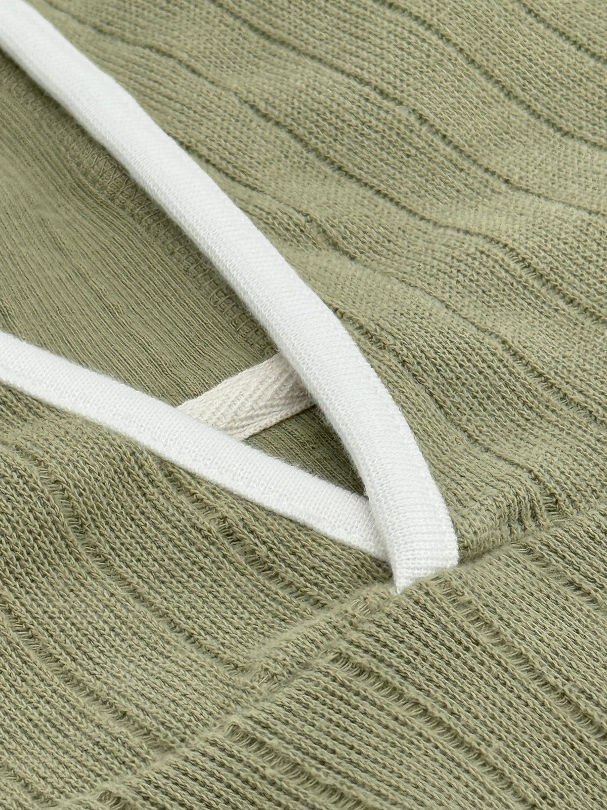 Close-up of the Captain's Pullover Hoodie rib knit and cream lined hood rim