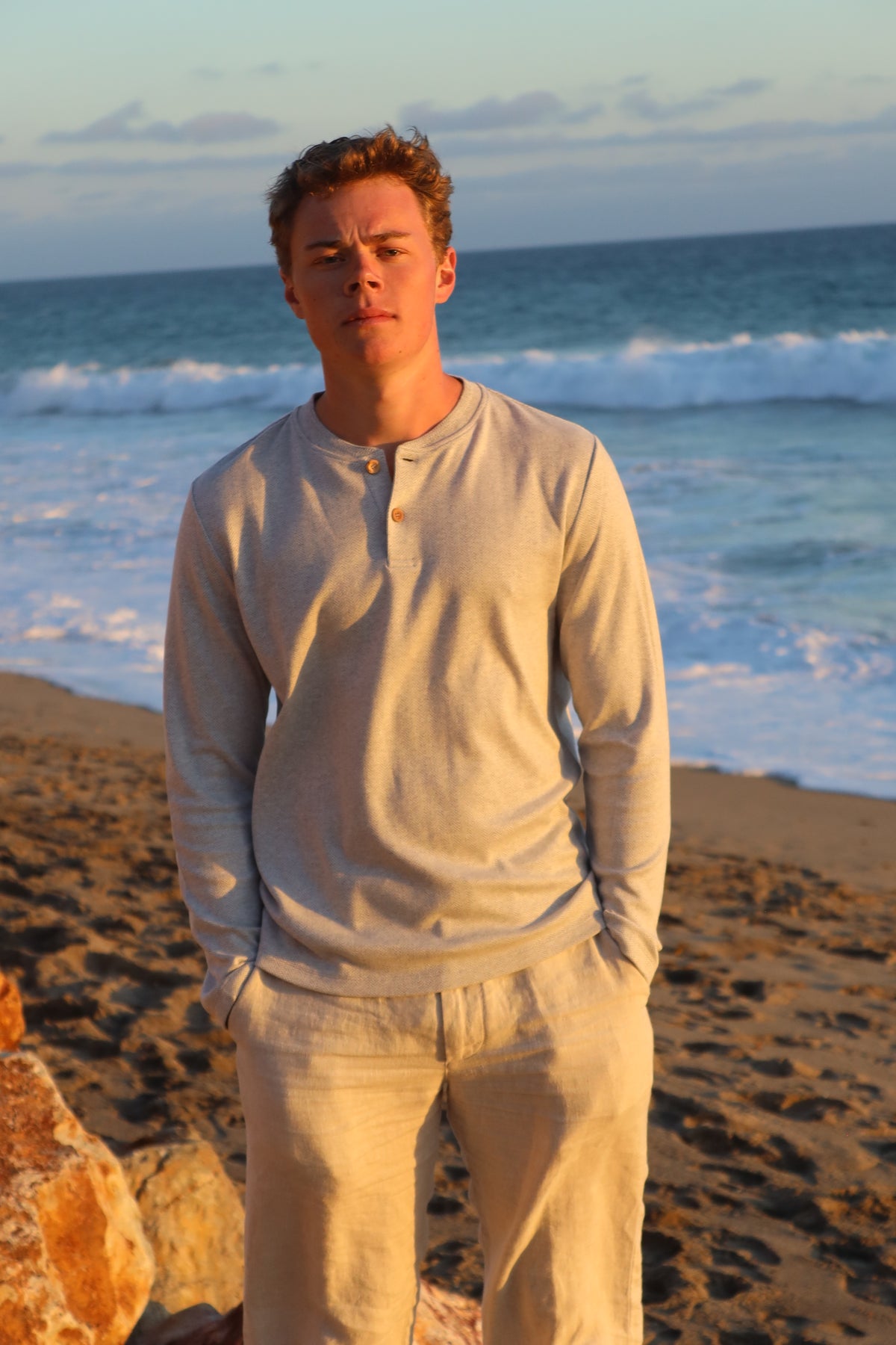 Herringbone Henley in Argent, worn on the beach